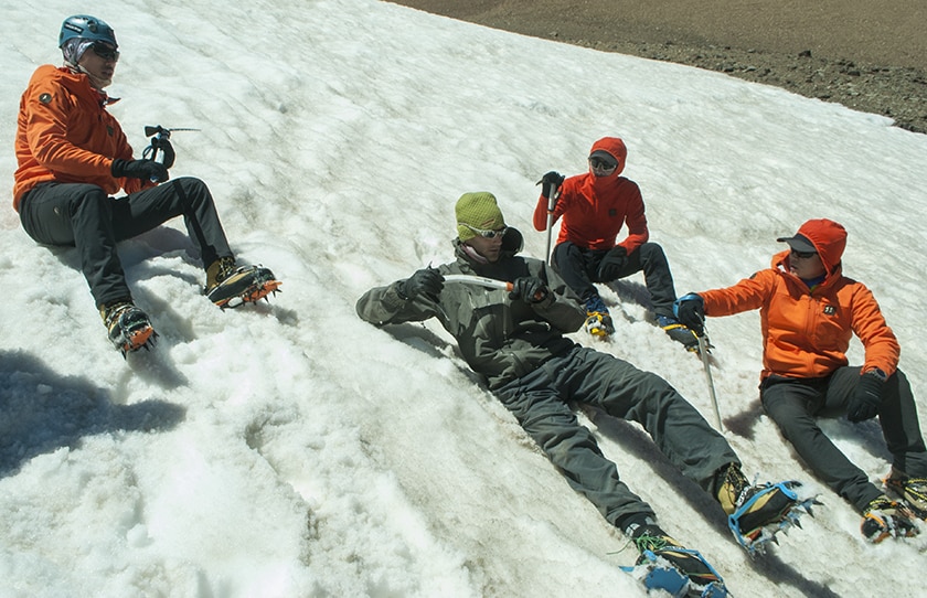 Benjamin going over crampons and ice axe techniques