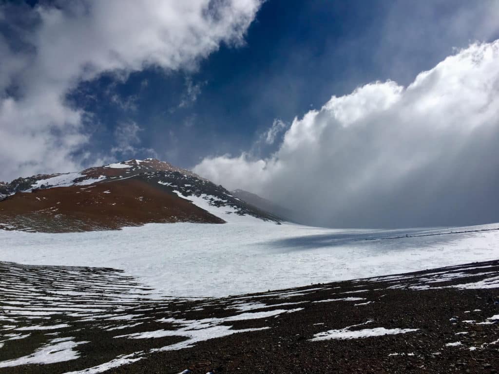 View from La Ollada high camp towards the south - Mercedario's main summit all the way in the back, partially covered by clouds